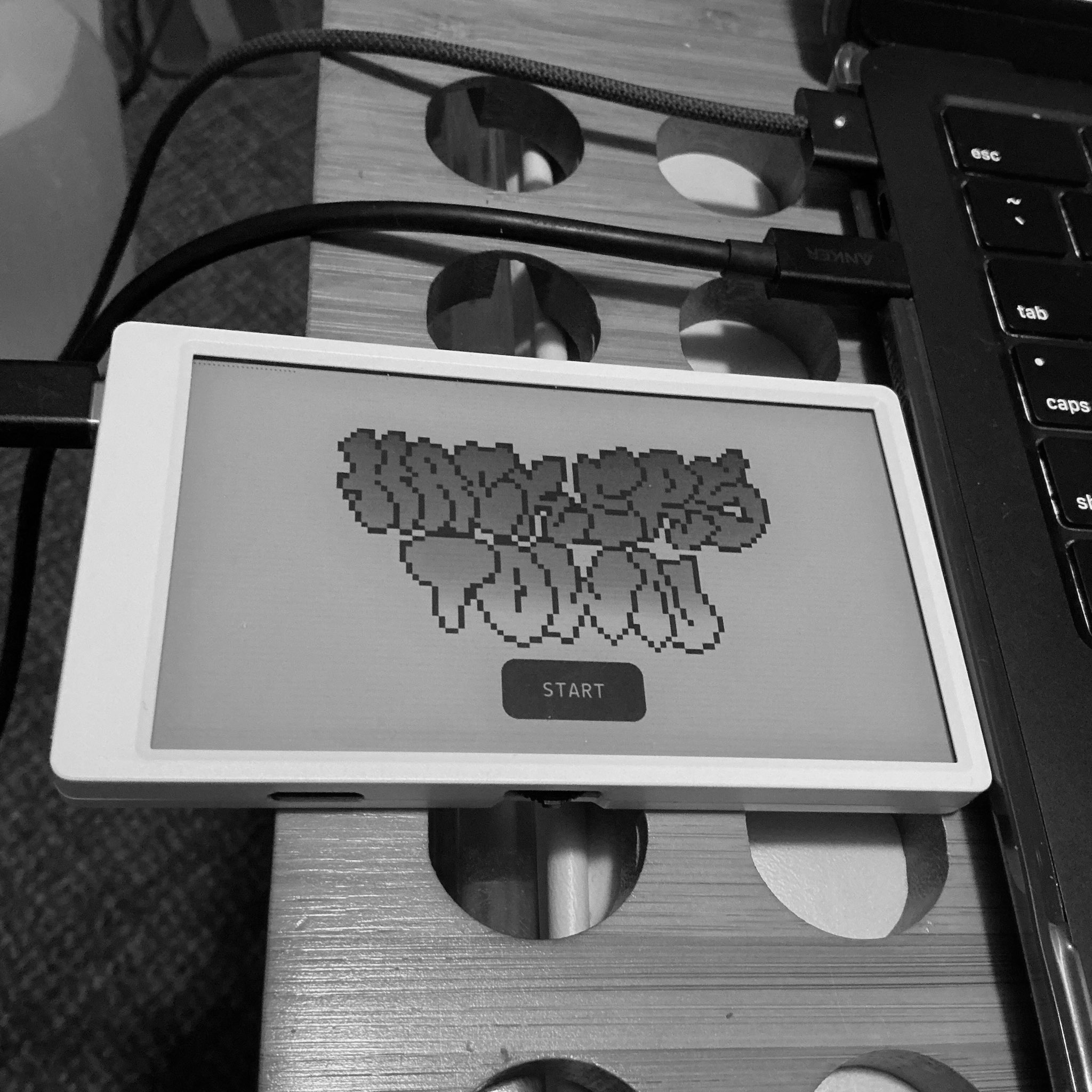 grafiti style art saying hackers.town and a start button